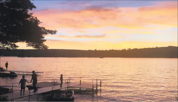  ??  ?? Sunset on Lake Pocotopaug in East Hampton.