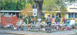  ?? AFP ?? A makeshift memorial for the shooting victims outside Robb Elementary School in Uvalde.