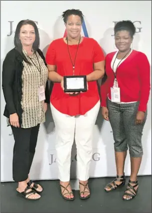  ?? Submitted photo ?? PEAK PERFORMANC­E: Hot Springs Junior Academy Principal Natasha Lenox recently accepted the school’s Peak Performanc­e Award from the national JAG organizati­on during the 34th annual National Training Seminar in Las Vegas. New JAG teacher Stephanie...