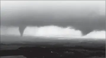  ?? KWTV-KOTV VIA AP ?? THIS IMAGE MADE FROM VIDEO PROVIDED BY KWTV-KOTV SHOWS TWO FUNNEL CLOUDS formed in Crescent, Okla., on Monday.