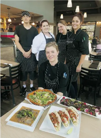  ?? LARRY WONG/ EDMONTON JOURNAL ?? Chef Kathryn Mitchell, front, and some of the staff at Branches Fresh Food Experience