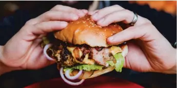  ?? STOCK.ADOBE.COM ?? Americans consume a beef equivalent of three hamburgers per week. One researcher says they need to immediatel­y cut that down to a hamburger and a half.