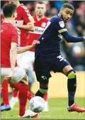  ??  ?? TUG: Boro’s Daniel Ayala fouls Derby County’s Jayden Bogle