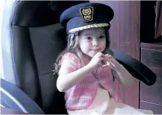  ?? KATHLEEN DRISCOL/ SPECIAL TO THE STANDARD. ?? Five-year-old Aisling DeGruchy Wednesday in the office of Niagara EMS Chief Kevin Smith.
