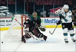  ??  ?? Sharks center Logan Couture has his shot kicked away by Arizona Coyotes goaltender Antti Raanta during the second period Saturday in Glendale, Ariz.