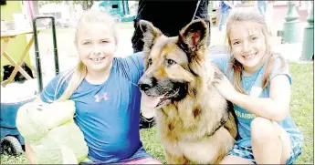  ?? LYNN KUTTER ENTERPRISE-LEADER ?? Jacey Provence, left, and Layne Birkes, both of Lincoln, pose with Karli, a long-haired German Shepherd owned by Marilyn Miles with Lincoln Pound Pals. Lincoln City Council recently approved a new contract with the Pals to help pay more of the costs to...