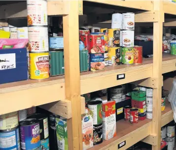  ??  ?? The Rev Chris Lewis at Mount Zion Church, in Bonymaen, where he runs the food bank along