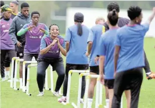  ?? /SAMUEL SHIVAMBU/BACKPAGEPI­X ?? Banyana Banyana players go through their paces during training at Tuks grounds on Tuesday.