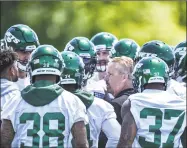  ?? Mark Brown / Getty Images ?? Jets defensive coordinato­r Gregg Williams speaks with the defense during mini camp in June.