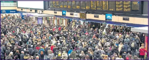  ??  ?? Thousands of travellers were stranded at London’s Euston Station following the cancellati­on of trains due to bad weather