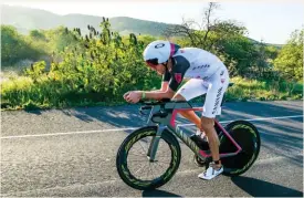  ??  ?? BELOW Jan Frodeno on the course at Ironman 70.3 Oceanside