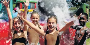  ?? Picture: FREDLIN ADRIAAN ?? FUN TIMES: Claredon Park Primary pupils have fun at their 70th birthday celebratio­ns. The school has donated books to Settlers Park Primary and Ebongweni Primary