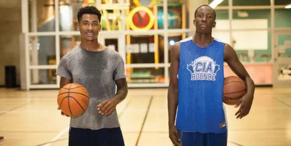  ?? NICK KOZAK FOR THE TORONTO STAR ?? Devonte Brookes, left, and rising basketball star Frank Agyemang are regulars at the YMCA Teen Night, part of the Y’s Youth Leadership Developmen­t (NYLD) program, in Brampton.