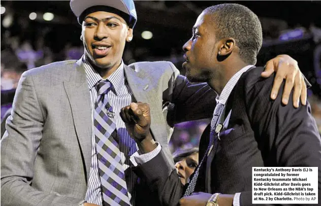  ?? Photo by AP ?? Kentucky’s Anthony Davis (l.) is congratula­ted by former Kentucky teammate Michael Kidd-Gilchrist after Davis goes to New Orleans as the NBA’s top draft pick. Kidd-Gilchrist is taken at No. 2 by Charlotte.