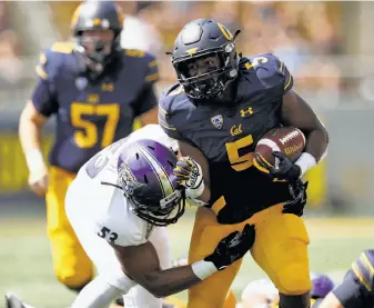  ?? Ezra Shaw / Getty Images ?? Cal senior running back Tre Watson had seven carries for 33 yards before leaving Saturday’s game against Weber State with a lower-body injury that will sideline him for the season.