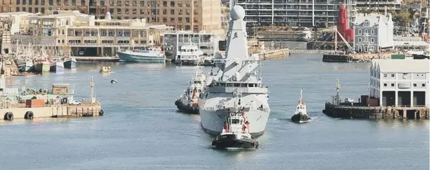  ?? ?? HMS Dauntless leaves modern Cape Town with, thankfully, no sign of a Vonk in the water. Picture: Royal Navy .