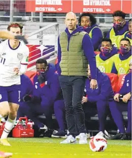  ?? JULIO CORTEZ AP ?? Coach Gregg Berhalter (center) has led the U.S. team to the same spot as five years ago, but hopes for a better outcome entering tonight’s game vs. Panama.