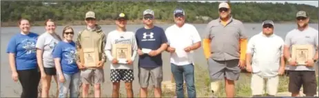  ?? Submitted Photo ?? Pictured are Place family members with Matt Place Memorial Tournament winners Christian Scott and Jacques Adams, runners-up Cody Ramsey and Robbie Brassfield and third-place anglers Sean Morrison and Justin Treat and big bass winner Eric Fairless.
