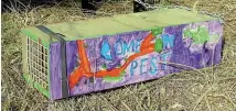  ??  ?? ‘‘Come on, pest,’’ says this trap painted by Foxton Beach schoolchil­dren.
