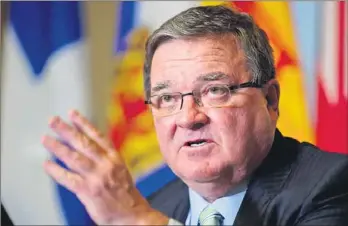  ?? CANADIAN PRESS PHOTO ?? Finance Minister Jim Flaherty speaks following the signing of an agreement on securities regulation Thursday on Parliament Hill in Ottawa.