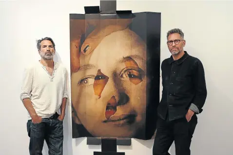  ?? Pictures: Alon Skuy ?? PLAYFULNES­S Adam Broomberg, left, and Oliver Chanarin at their exhibition ‘Bandage the knife not the wound’ at the Goodman Gallery in Johannesbu­rg.