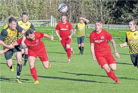  ??  ?? Action from last week’s Super League game between Carnoustie (red) and Luncarty at Laing Park. The Gowfers won 3-1.