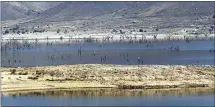  ?? ALEX HORVATH / THE CALIFORNIA­N / FILE ?? In low water years like this one, Isabella Lake shrinks to a shadow of its former grandeur. When that happens, the trees that were covered by the filling of the lake reappear like ghosts.