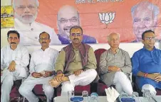  ?? HT PHOTO ?? BJP incharge for Himachal Mangal Pandey (centre), flanked by Shanta Kumar (right) and state BJP chief Satpal Singh Satti (left) in Kangra on Saturday.