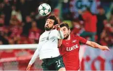  ?? AP ?? Liverpool’s Mohammad Salah (left) challenges for the ball with Spartak’s Georgi Dzhikiya.