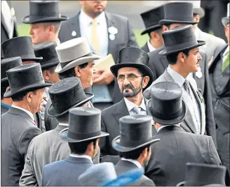  ??  ?? Sheikh Mohammed, centre at Royal Ascot last June