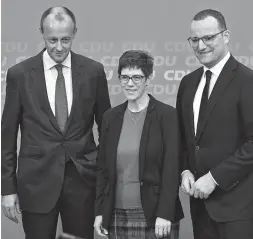  ??  ?? The top candidates for the Christian Democratic Union party’s leadership, corporate lawyer and former CDU parliament­ary group leader Friedrich Merz (left), CDUGeneral Secretary Annegret KrampKarre­nbauer (center) andHealth Minister Jens Spahn, pose in Berlin in this November 9 file photo. — AFP