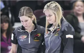  ?? JUSTIN TANG/THE CANADIAN PRESS ?? Third Kaitlyn Lawes, left, talks strategy with skip Jennifer Jones during action at the Olympic trials in Ottawa.