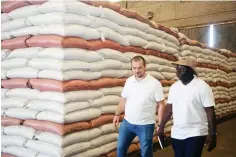  ?? Picture: Joseph Manditswar­a ?? Lands, Agricultur­e, Fisheries, Water and Rural Developmen­t, Deputy Minister Vangelis Haritatos (left) and Chain Supply Manager Obert Zhoya inspect wheat stocked at GMB Aspindale depot donated by Russia yesterday.—