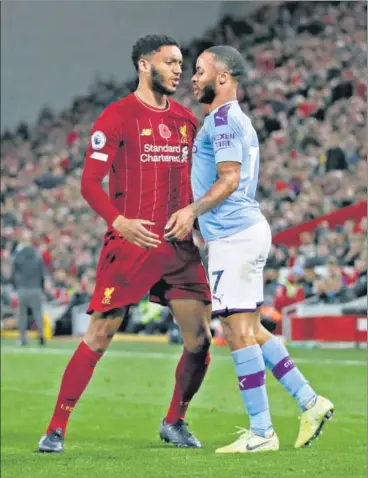  ?? REUTERS ?? ■
Liverpool’s Joe Gomez (left) and Manchester City's Raheem Sterling clashed during their Premier League match on Sunday and there was a repeat when they met the next day in the England camp.