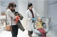  ?? CHRISTOS KALOHORIDI­S / NETFLIX ?? In Arkangel, a mother (Rosemarie DeWitt, left) has a surveillan­ce implant placed in the head of her daughter (Aniya Hodge).