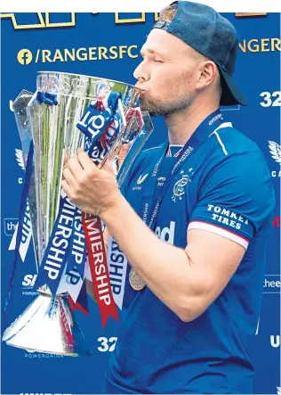  ?? ?? Greg Stewart after winning the Premiershi­p trophy with Rangers in 2021