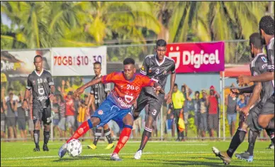  ?? Photo: Leon Lord ?? Navua midfielder Alfred Tahir Ali makes an attempt as the Ba defenders close in during their Digicel Premier League clash on April 11, 2021.