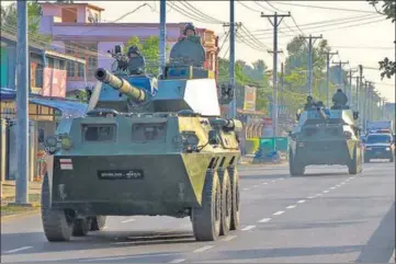  ?? AFP ?? Armoured vehicles are seen rolling down the streets of Myitkyina in Myanmar’s Kachin state on Wednesday.