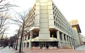  ?? THE ASSOCIATED PRESS ?? The FBI building is seen Friday in Washington. A new congressio­nal memo alleges FBI surveillan­ce abuse is being used to undermine the legitimacy of special counsel Robert Mueller’s Russia investigat­ion. But included in the four-page document are...