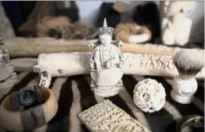  ??  ?? Taken to ‘tusk’: Ivory carvings seized by the UK Border Force at Heathrow Airport sitting on display at Custom House in London. — Reuters