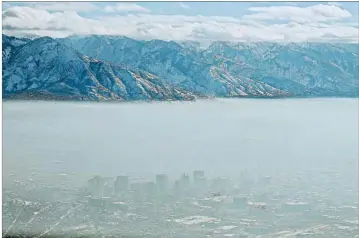  ?? JEFFREY D. ALLRED/THE DESERET NEWS ?? Harvard researcher­s studied Medicare data from 2000 to 2017. Salt Lake City sits shrouded in haze during an inversion.