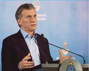  ?? BLOOMBERG PIC ?? Argentina President Mauricio Macri says the Internatio­nal Monetary Fund will accelerate the disburseme­nt of a US$50 billion standby loan it agreed to extend to the country in June.