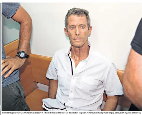  ??  ?? Diamond magnate Beny Steinmetz arrives at court in Tel Aviv. Police said he has been detained on suspicion of money laundering, fraud, forgery, obstructio­n of justice and bribery