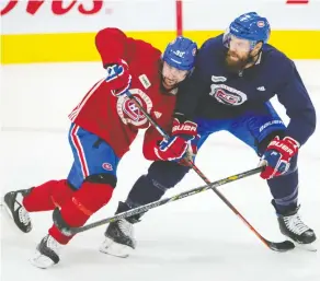  ?? RYAN REMIORZ / THE CANADIAN PRESS ?? Canadiens defenceman Shea Weber, right, defends against forward Tomas Tatar in the club’s first team practice Monday in Brossard, Que. Weber pulled himself from practice
Tuesday but his coach said he expects the captain back Wednesday.