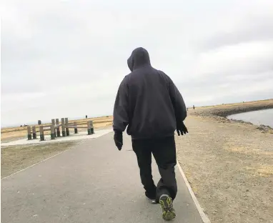  ?? KRISTOPHER SKINNER/STAFF ?? A man is bundled up against the morning chill at Faro Point near the marina in San Leandro on Thursday.