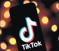  ?? LIONEL BONAVENTUR­E/GETTY-AFP ?? TikTok has become a target of President Donald Trump, who said he would ban the social media app in the U.S.