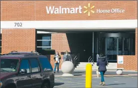  ?? NWA Democrat-Gazette/DAVID GOTTSCHALK ?? People walk Thursday outside Walmart Home Office in Bentonvill­e. Wal-Mart Stores Inc. conducted a larger round of job cuts at its corporate offices in Bentonvill­e on Thursday, eliminatin­g positions across several department­s.