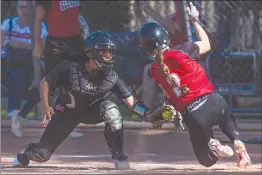  ?? Chris Torres/The Signal ?? Hart’s Kaylee Rodriguez (27) tags out the runner at home plate in the sixth inning of the first round game for the Division 2 CIF Section Softball Championsh­ips between the Hart Indians and the Glendora Tartans at Newhall Park on Thursday,