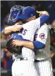  ?? Associated Press ?? Chicago Cubs catcher Willson Contreras hugs pitcher Jon Lester after their 4-1 win over the San Francisco Giants on Tuesday in Chicago.