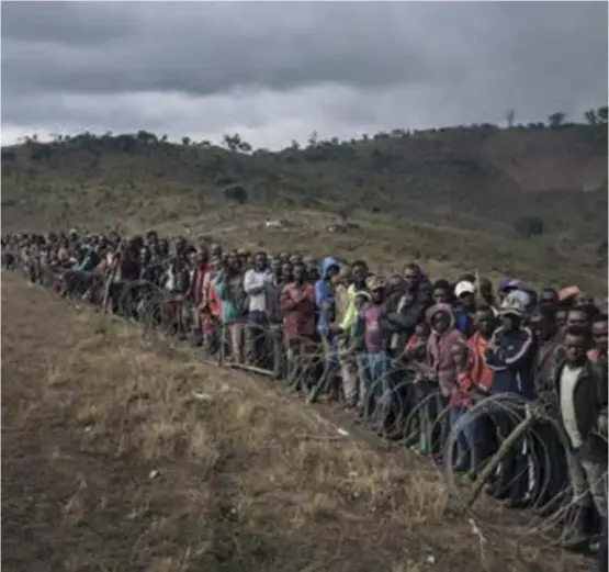  ??  ?? Internally displaced persons gather for government briefing in South Kivu, eastern Democratic Republic of Congo, the scene of violent clashes between rival communitie­s since 2019.